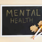 importance of mental health text in black chalkboard on slat