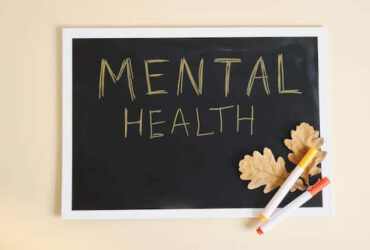 importance of mental health text in black chalkboard on slat