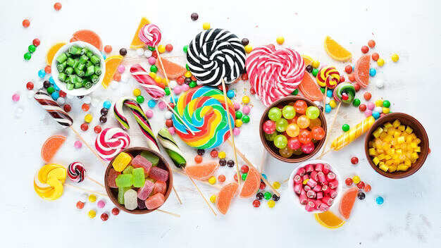 colorful candies jelly marmalade white wooden background sweets top view 